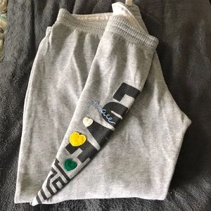 Pink sweat-pant capris